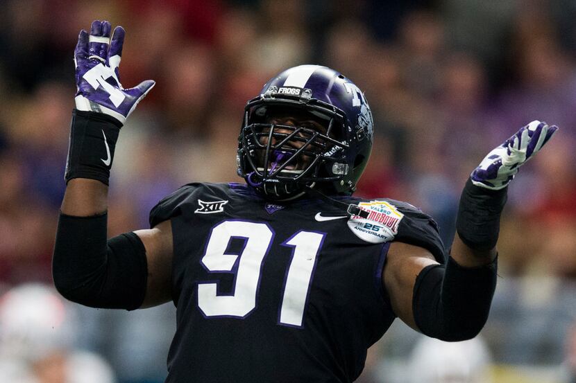 TCU Horned Frogs defensive tackle L.J. Collier (91) celebrates a hit during the fourth...