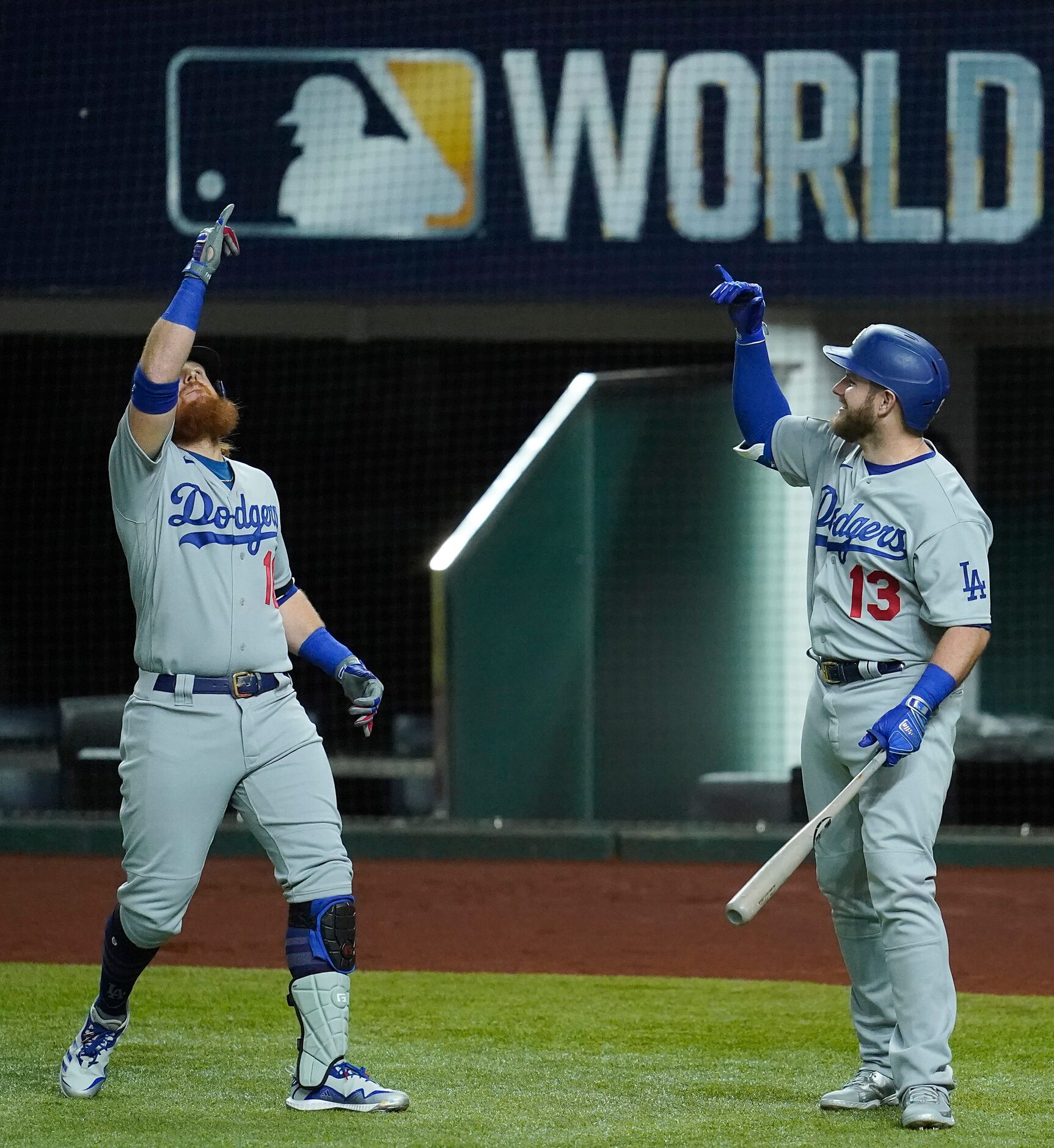 Los Angeles Dodgers third baseman Justin Turner (10) celebrates with first baseman Max Muncy...