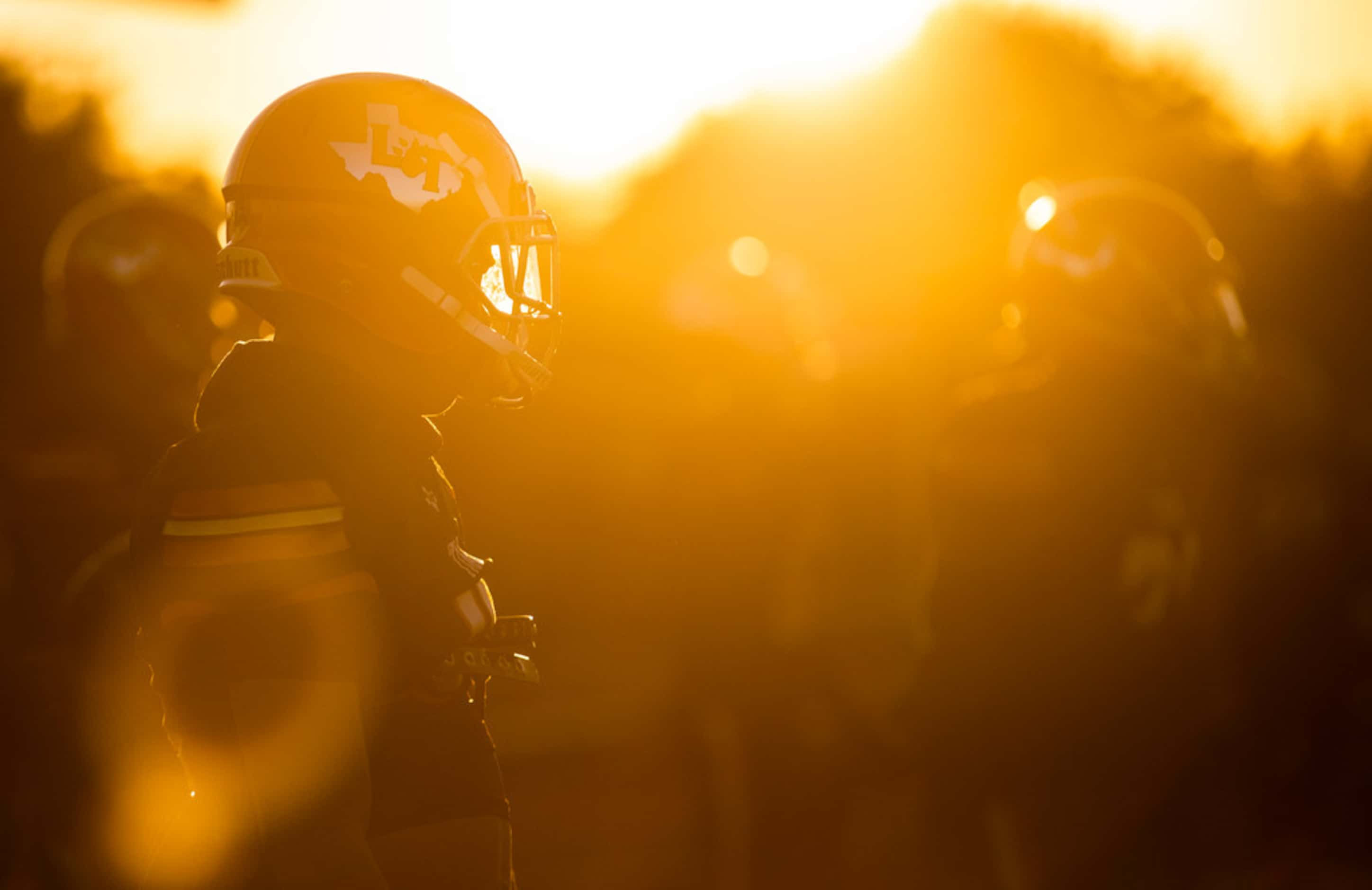 Lancaster players warm up before a District 6-5A Division I high school football game...