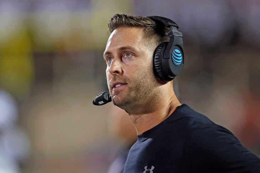 Texas Tech coach Kliff Kingsbury looks at the scoreboard during the team's NCAA college...