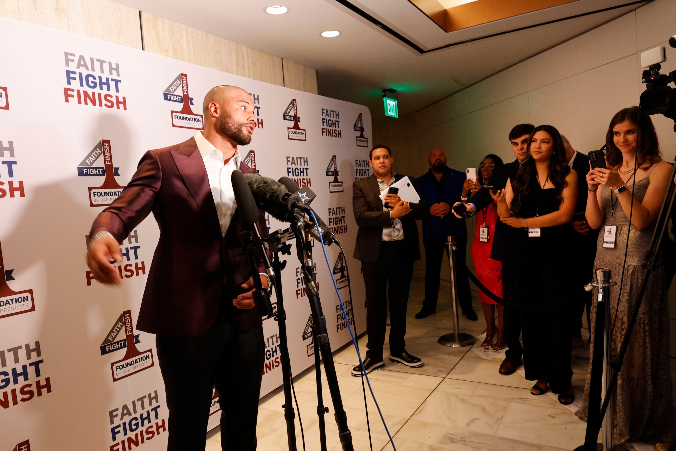 Dallas Cowboys quarterback Dak Prescott speaks to reporters during the Faith Fight Finish...