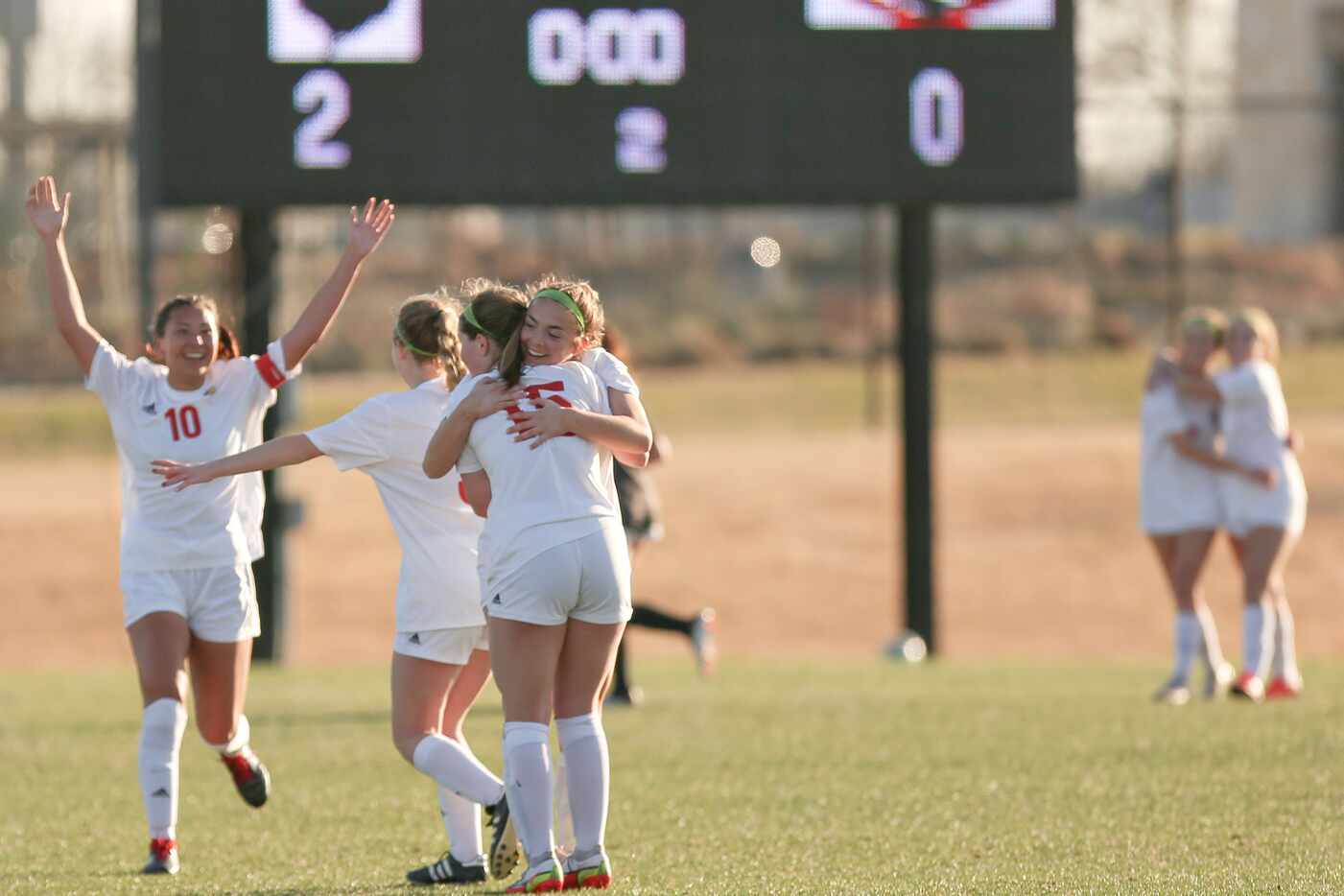 John Paul II’s players celebrate after their win at their Division I girls state...