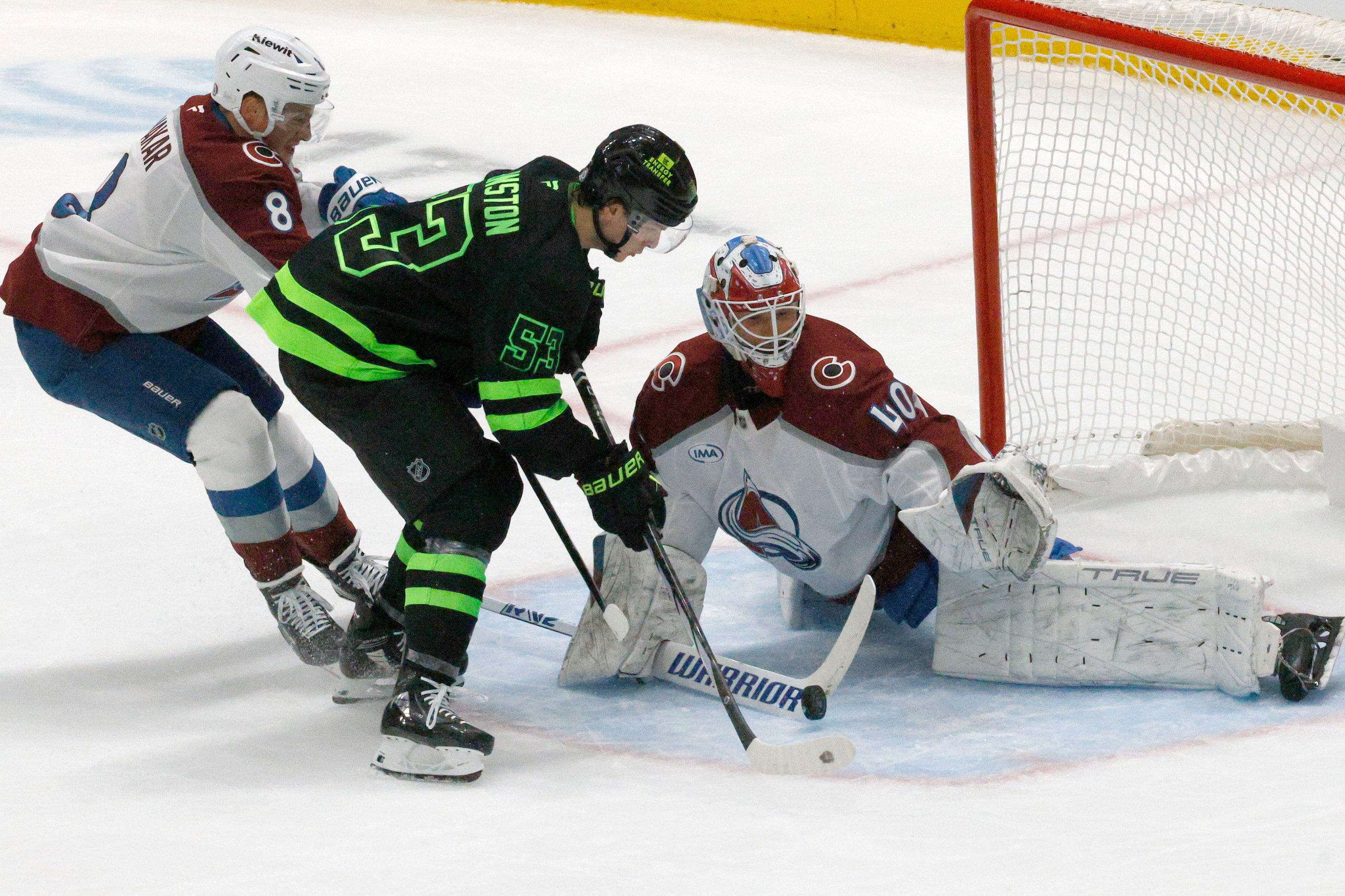 Dallas Stars center Wyatt Johnston (53) tires to shoot against Colorado Avalanche goaltender...