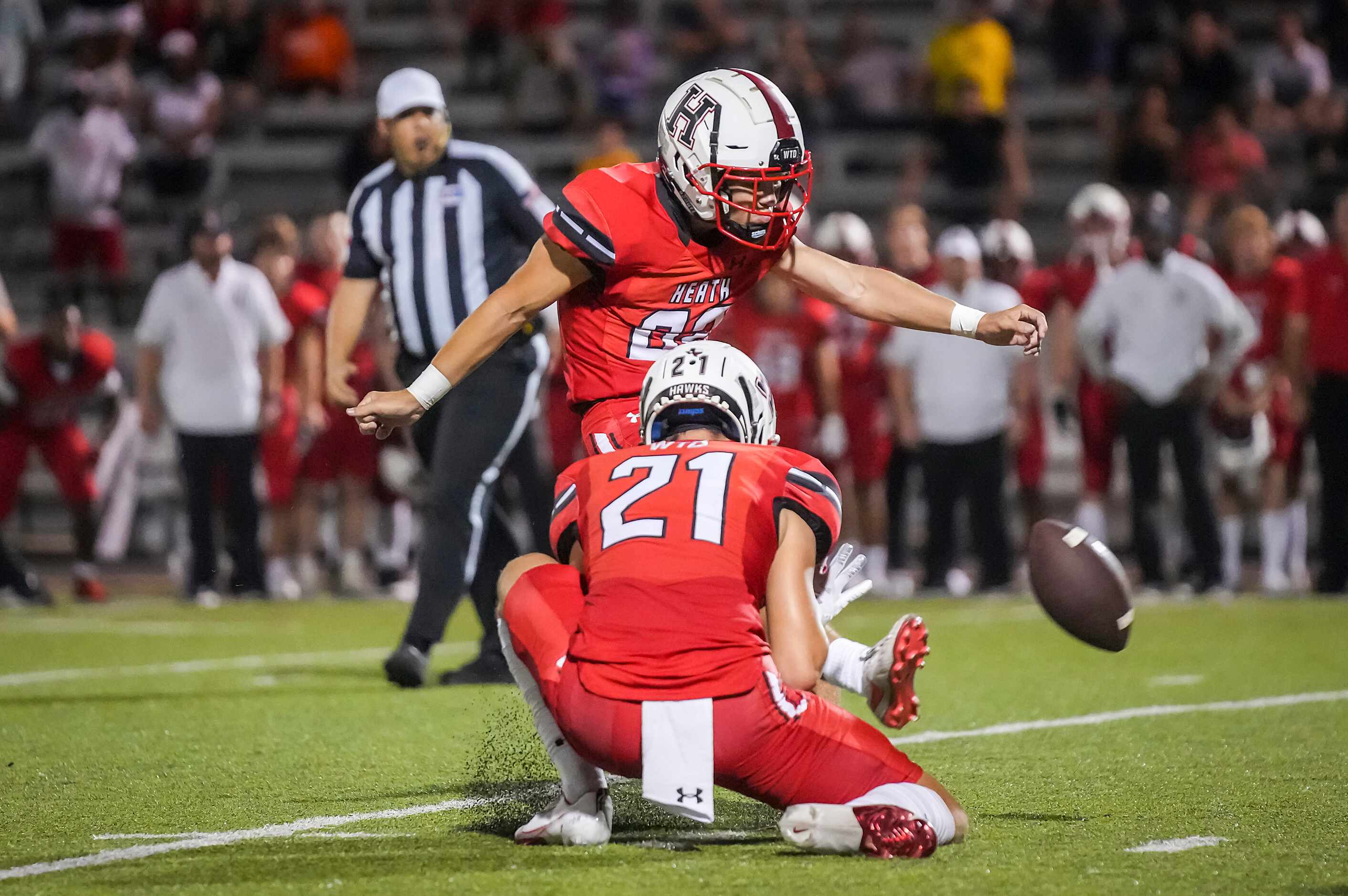 Rockwall-Heath kicker Sam Spencer (82) misses on a 26-yard field goal attempt from the hold...