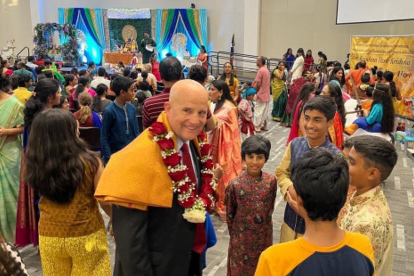 Keith Self visiting with children at Krishna Janmastami Festival