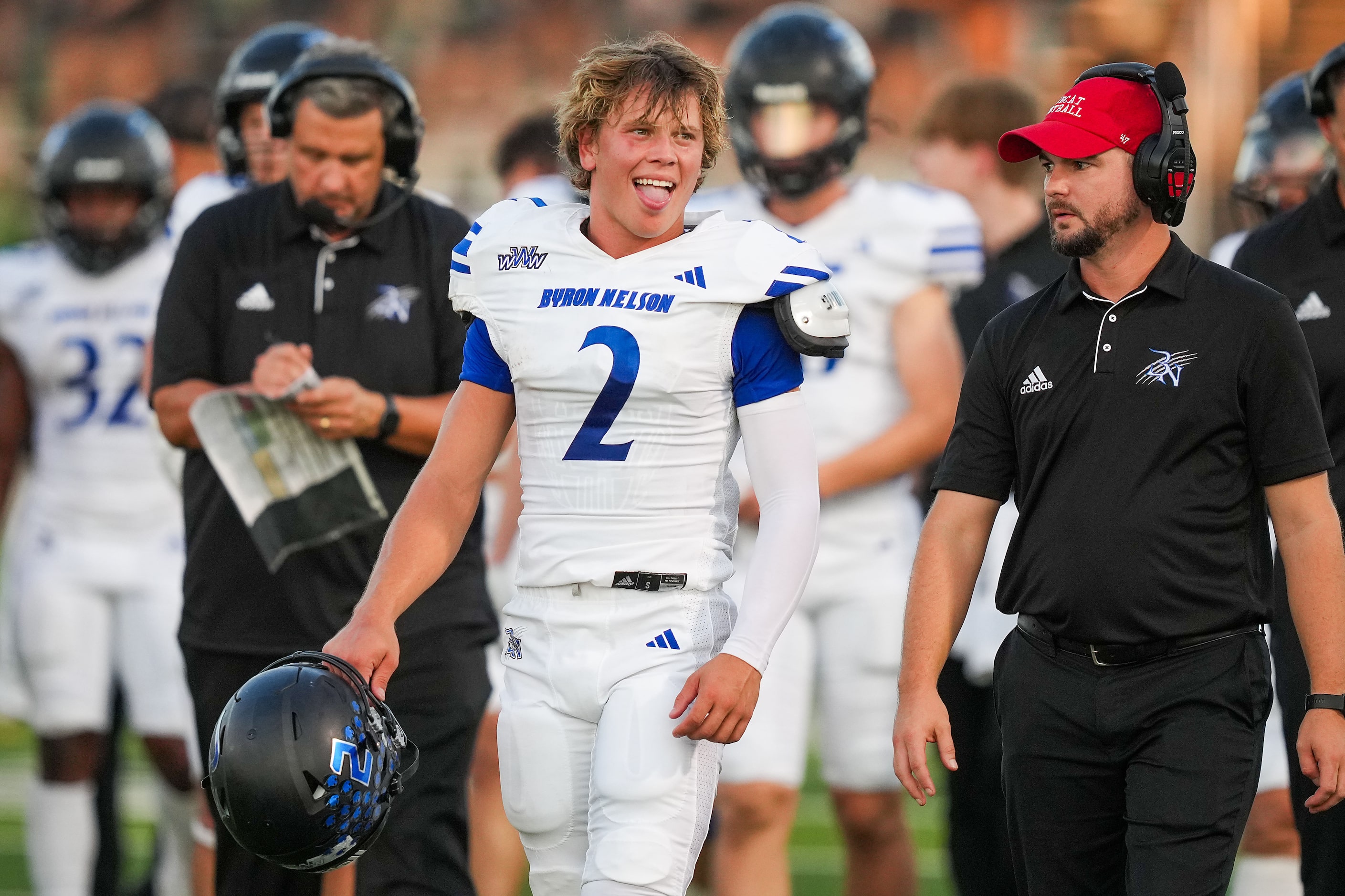 Trophy Club Byron Nelson quarterback Grant Bizjack (2) laughs during a timeout during the...