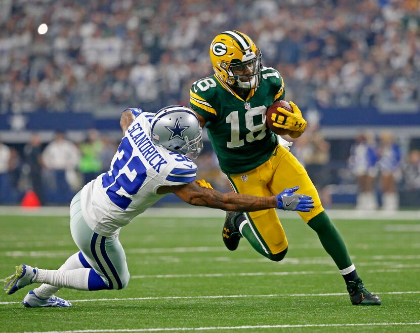 Green Bay Packers wide receiver Randall Cobb (18) is tackled by Dallas Cowboys cornerback...