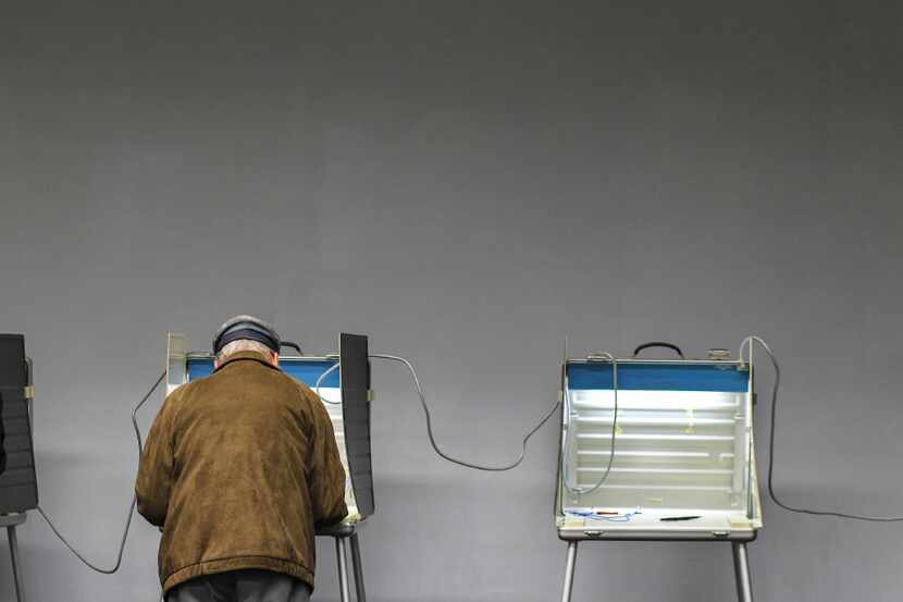 A voter cast his ballot on Election Day last Nov. 8 in Wellesley, Mass.