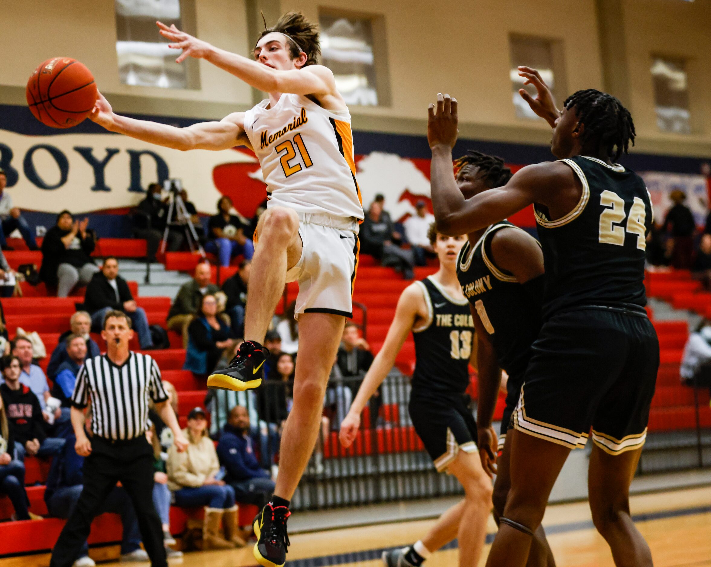 The ball is thrown out of bounds by Memorial High School Drew Steffe (21) as he attempts to...