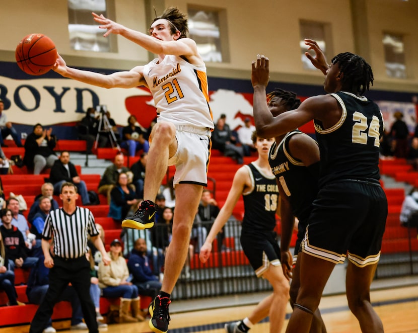 The ball is thrown out of bounds by Memorial High School Drew Steffe (21) as he attempts to...