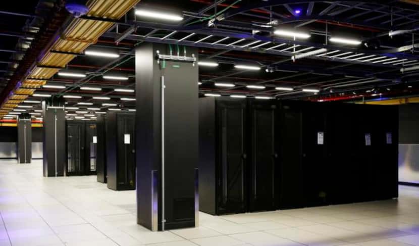 
Cabinets in the Equinix data center stand ready for future clients. The need for data...