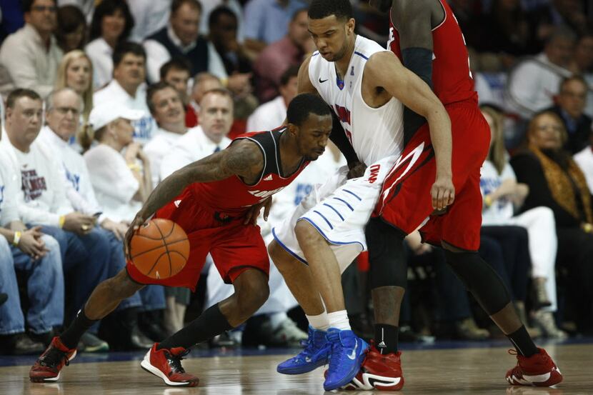 SMU's Nick Russell (12) runs into Louisville's Chris Jones (3) during their game at Moody...