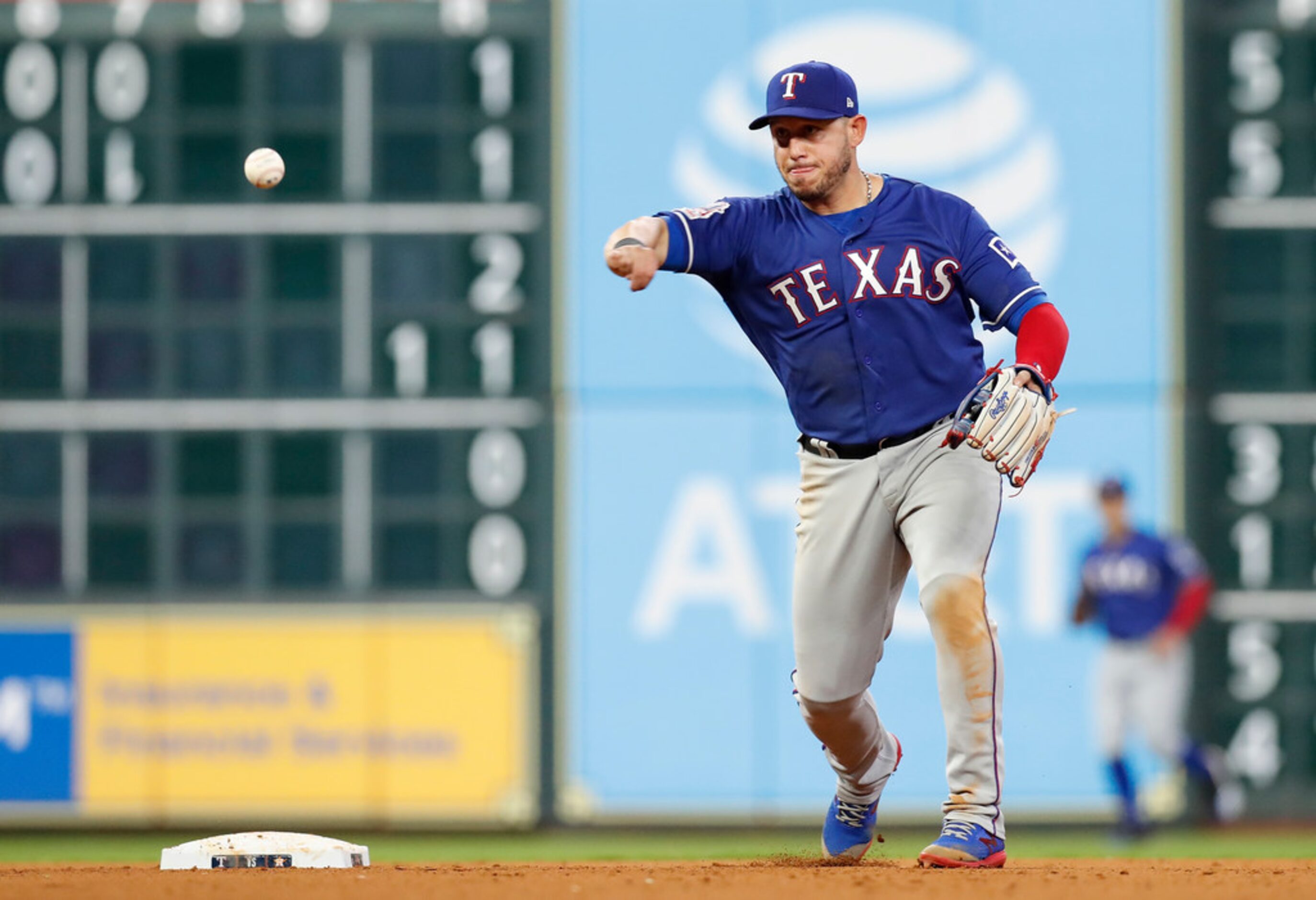 HOUSTON, TX - MAY 10:  Asdrubal Cabrera #14 of the Texas Rangers throws to first for a...