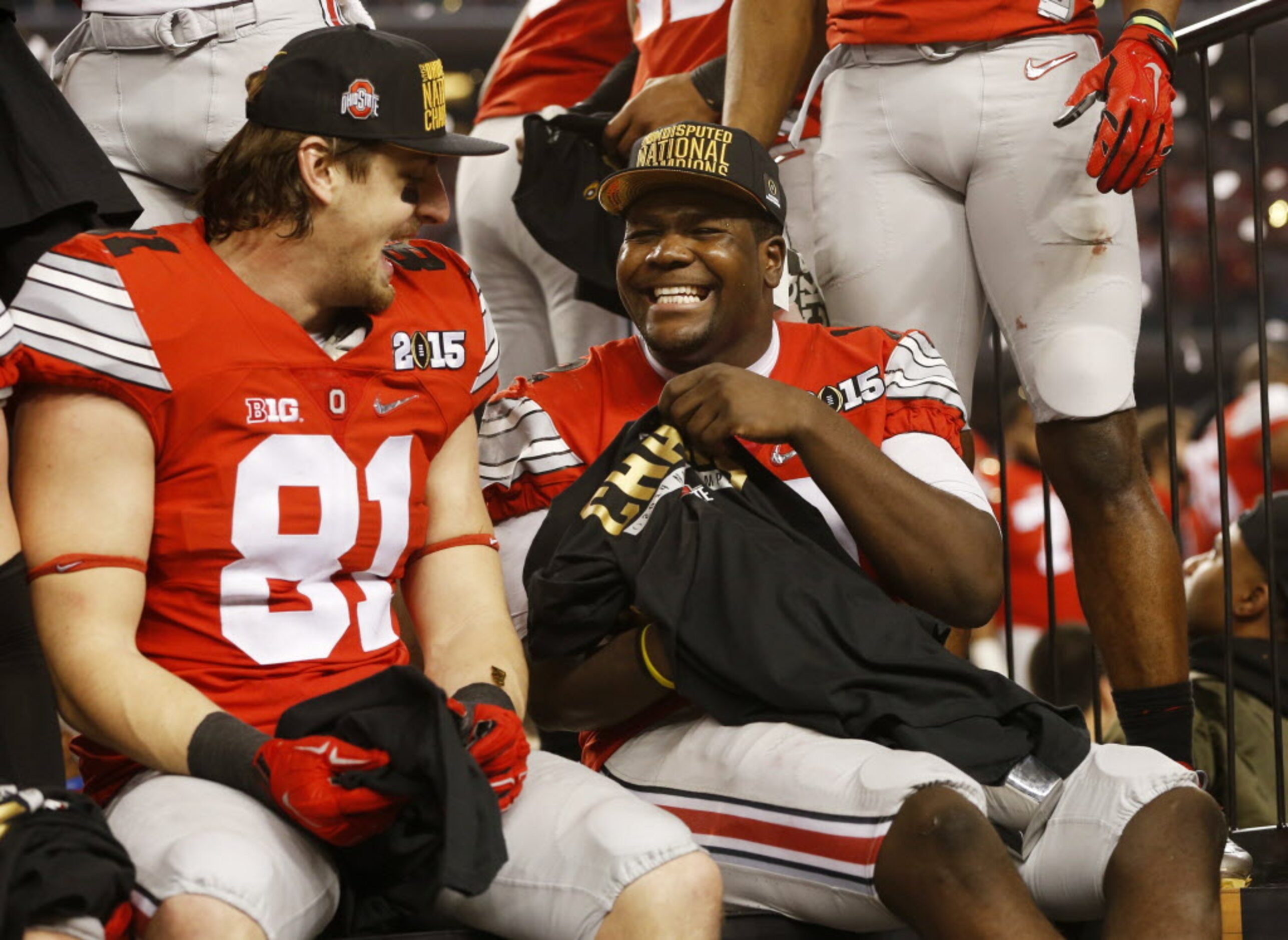 Ohio State Buckeyes quarterback Cardale Jones (12) shares a laugh with Oregon Ducks tight...