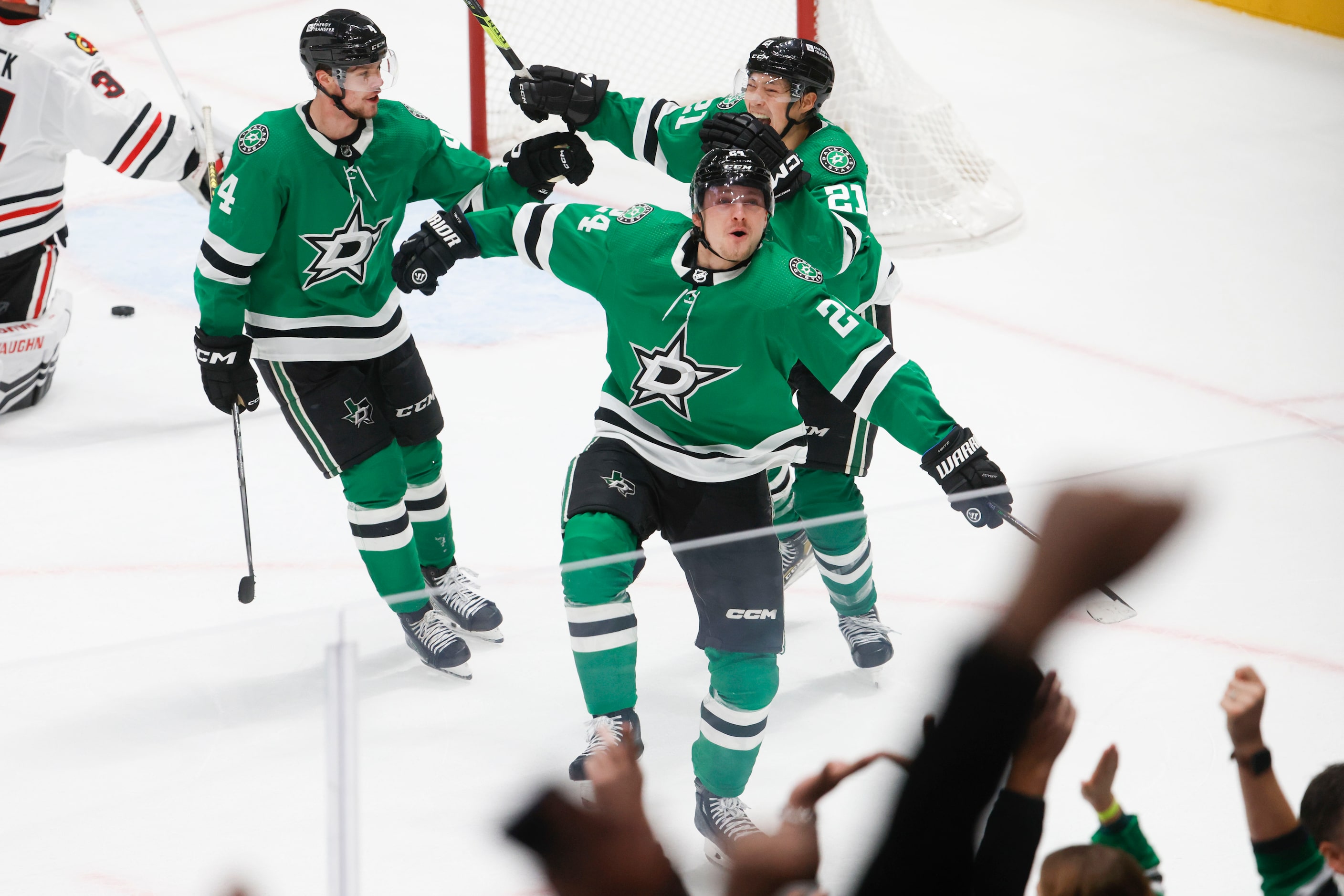 Dallas Stars center Roope Hintz (24) celebrates with Miro Heiskanen (4) and left wing Jason...