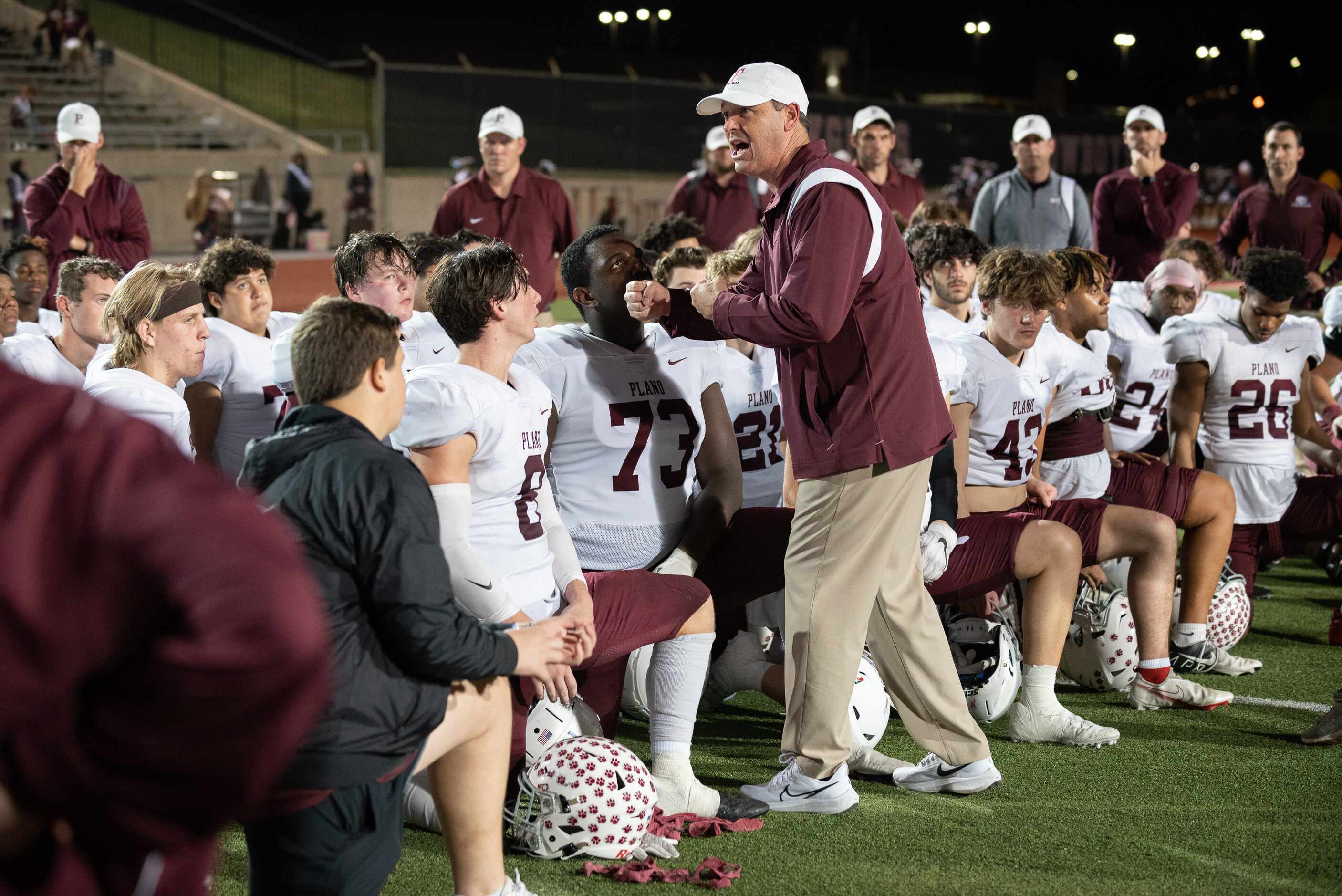 Plano Wildcats head coach Todd Ford speaks with his team after they were defeated 34 to 7 by...