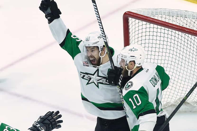 Texas Stars left wing Curtis McKenzie, left, celebrates his goal with teammate Justin...