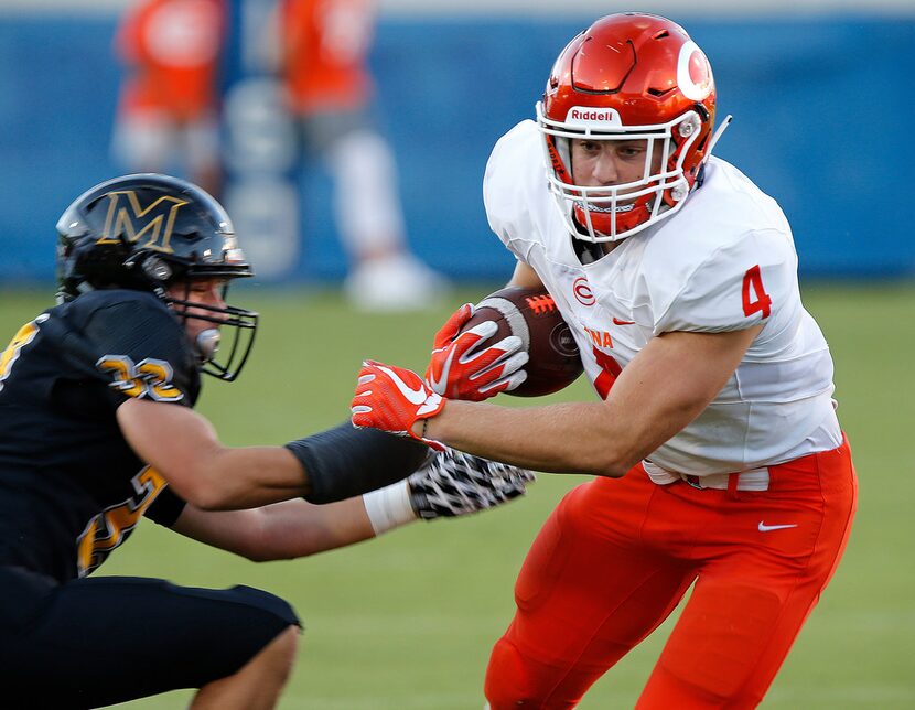 Celina High School running back Logan Point (4) gets by Memorial High School defensive back...