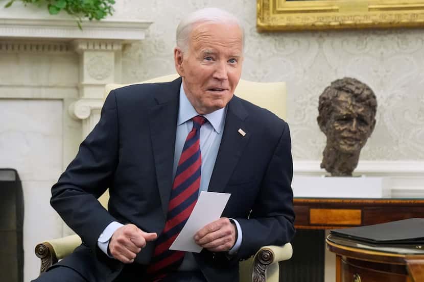 President Joe Biden listens to a question as he meets with NATO Secretary General Jens...