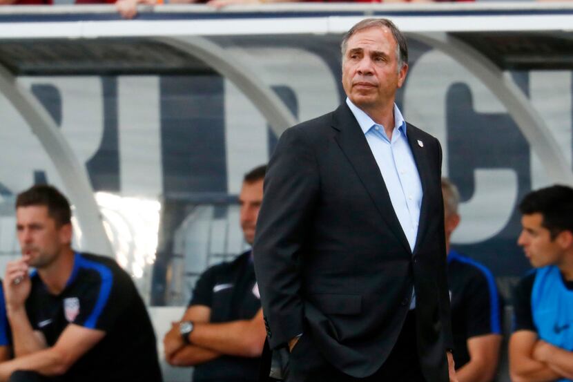 FILE- In this June 8, 2017, file photo, United States coach Bruce Arena watches during the...