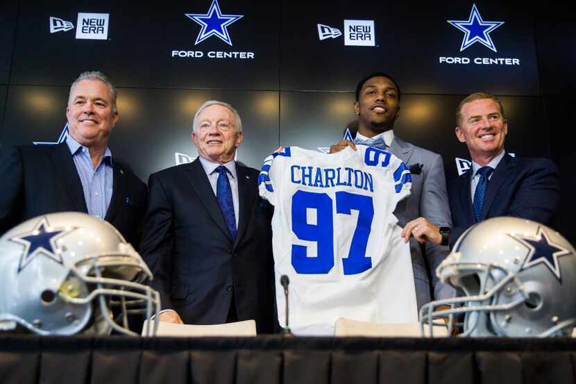 The Dallas Cowboys first round draft pick, defensive end Taco Charlton, is presented with a...