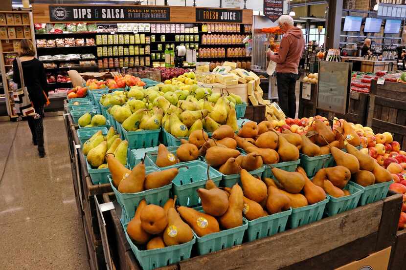 In this May 3, 2017, photo, fresh fruit is displayed in a Whole Foods Market grocery store,...