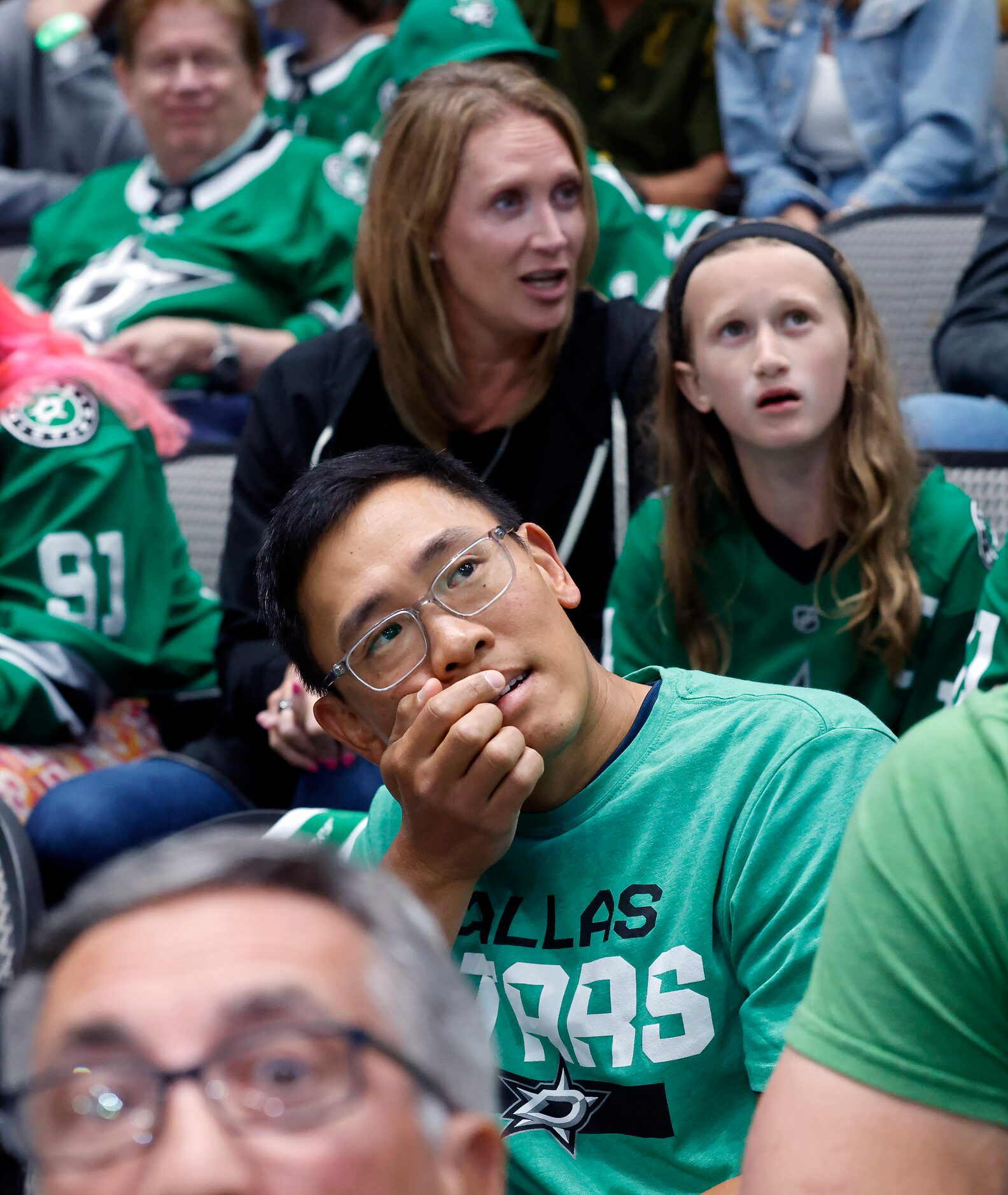 Dallas Stars fans, including Spencer Jan of Keller (center) react to a Vegas Golden Knights...