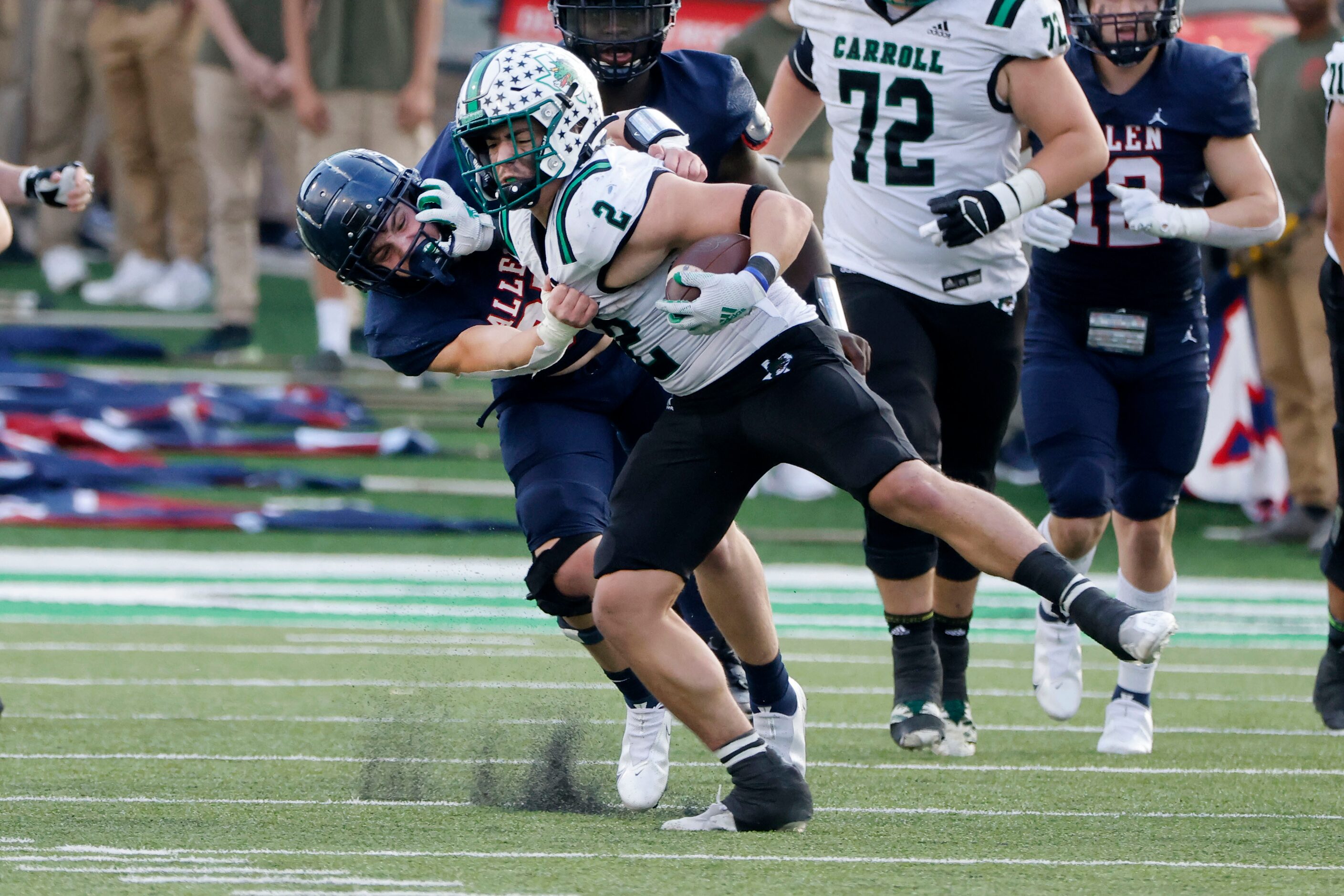 Southlake Carroll’s Owen Allen (2) tries to get away from Allen’s Blake Harvey (35) during...