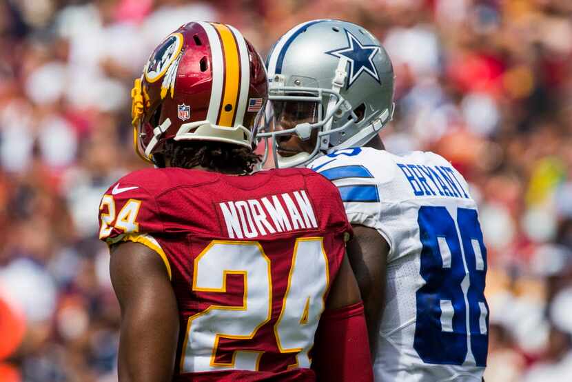 Dallas Cowboys wide receiver Dez Bryant (88) talks with Washington Redskins cornerback Josh...