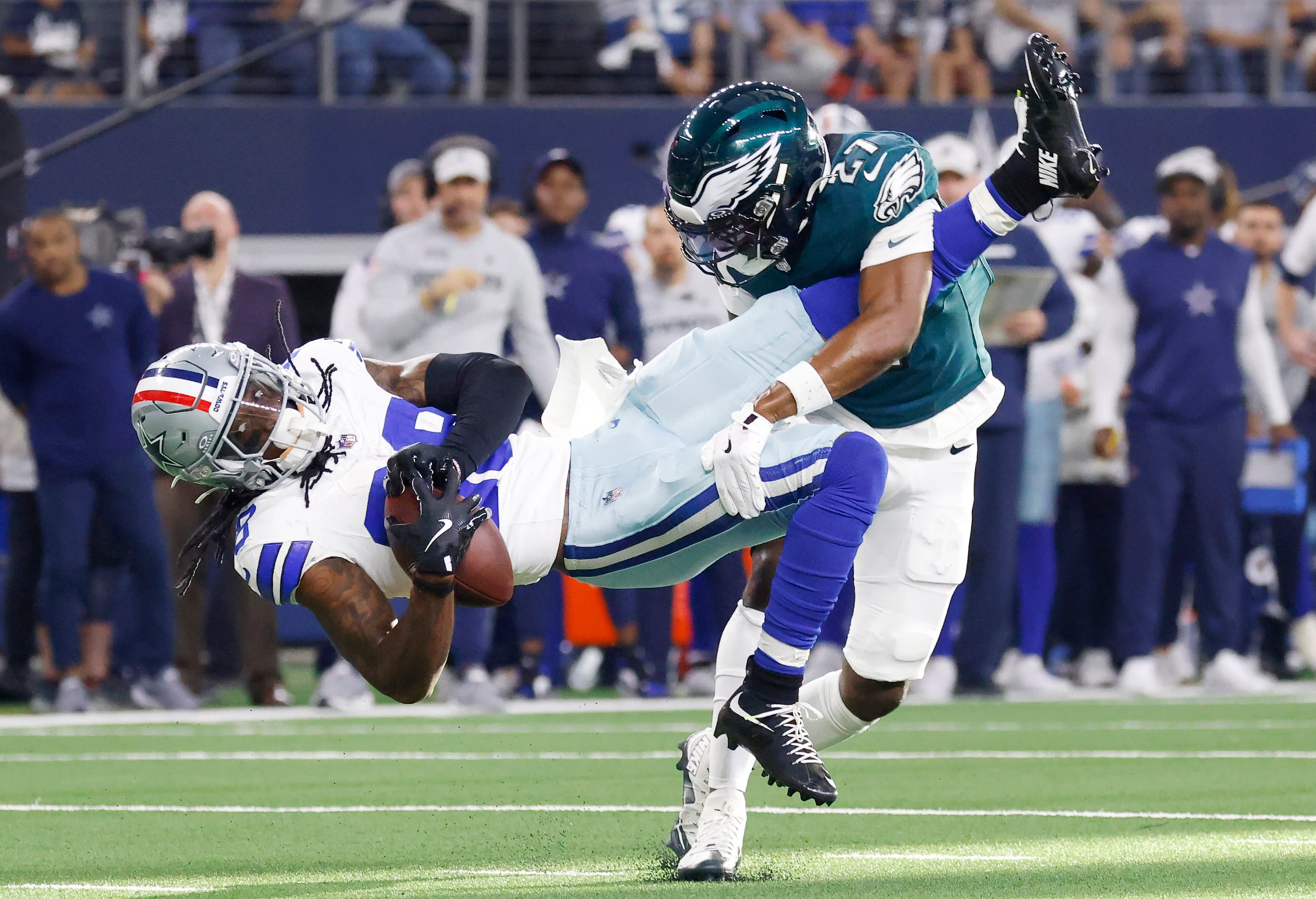 Dallas Cowboys wide receiver CeeDee Lamb (88) is tackled by Philadelphia Eagles cornerback...