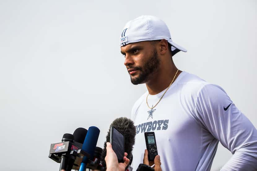 Dallas Cowboys quarterback Dak Prescott (4) speaks to reporters after the Blue and White...