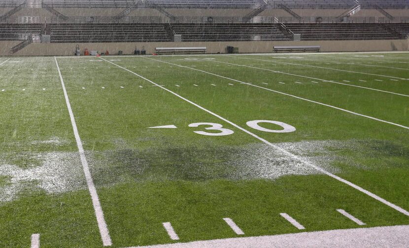 Heavy rain and puddles form on the turf at C.H. Collins Ath. Complex in Denton before the...