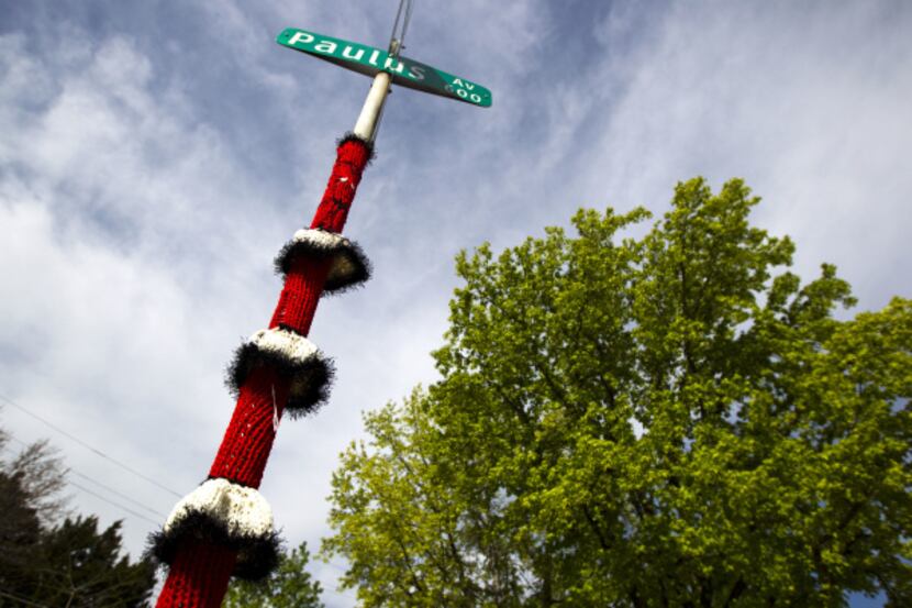 This street sign at Paulus Avenue and Abrams Road in East Dallas was yarn bombed by K Witta.