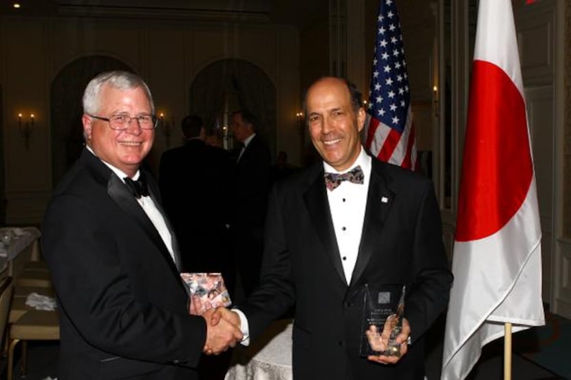 
Award recipients Timothy C. Jones, left, and Ambassador John V. Roos at the 2014 Sun and...