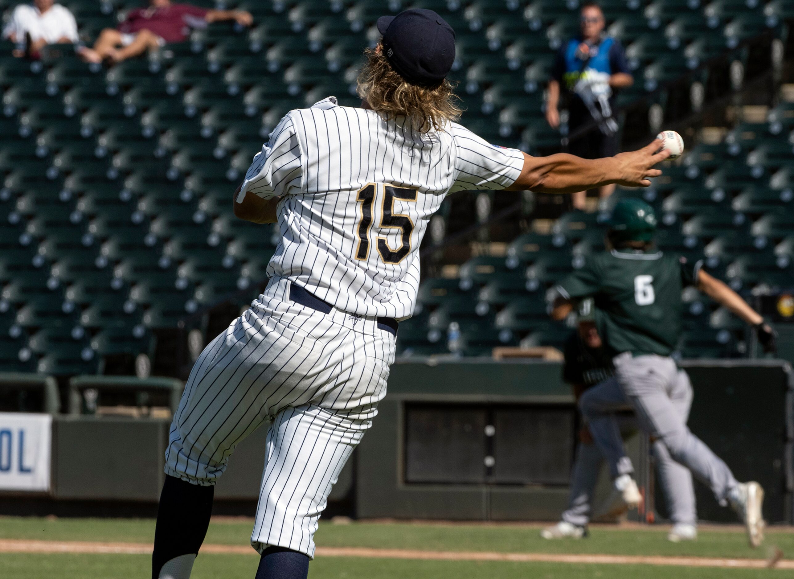 Keller Mike Dattalo, (15), throws to first base after a ground ball hit by Houston Strake...