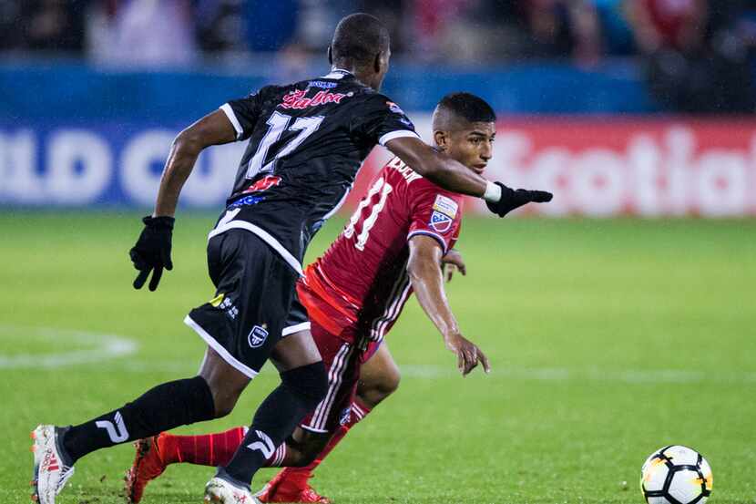 FC Dallas midfielder Santiago Mosquera (11) and Tauro F.C.'s Oscar Villarreal (17) run for...