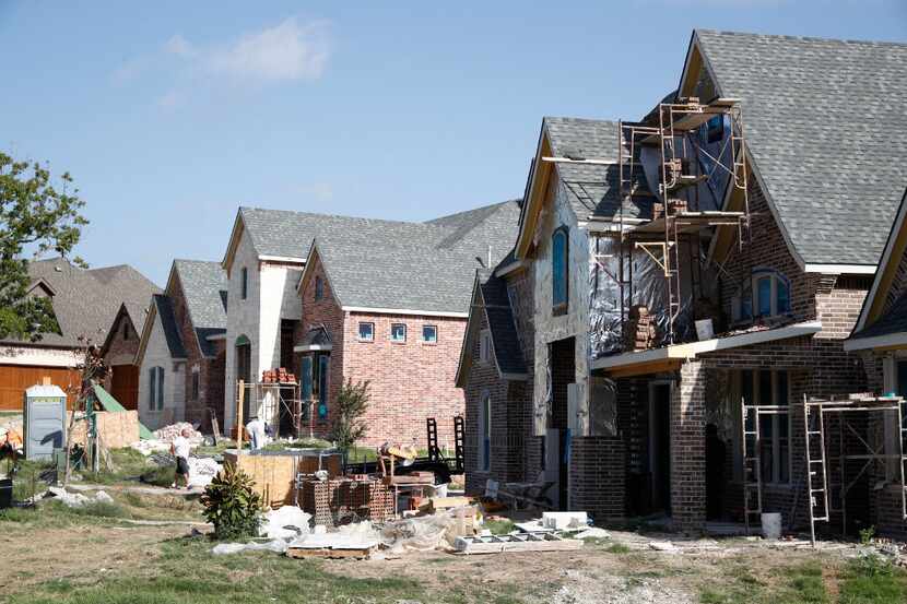Nearly finished houses in the neighborhood on Sept. 8, 2016 in Rowlett. (Ting Shen/The...