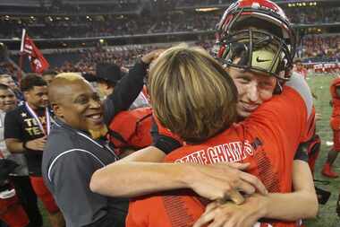 Cedar Hill kicker Brooks Ralph gets a hug after his kick won the game 23-20 for the...