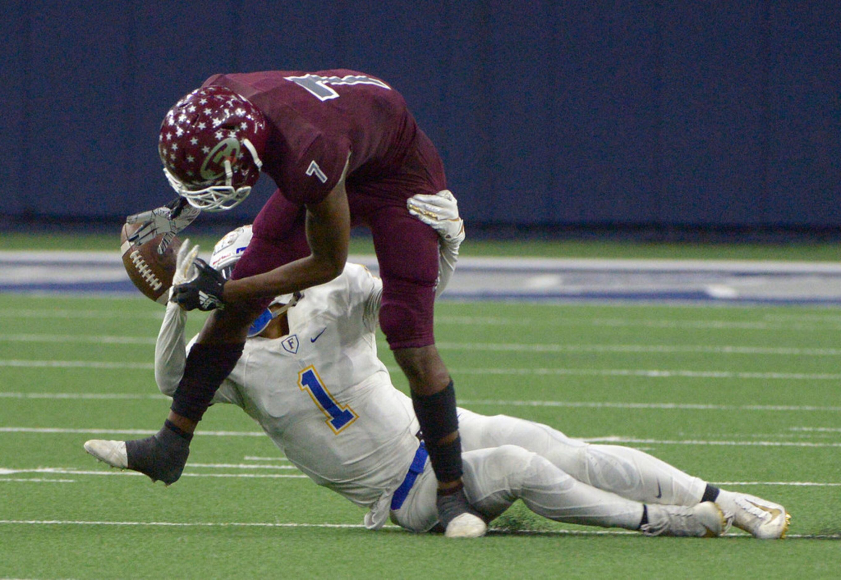 Frisco's Myles Mays (1) breaks up a pass intended for Ennis' Laylon Spencer in the second...