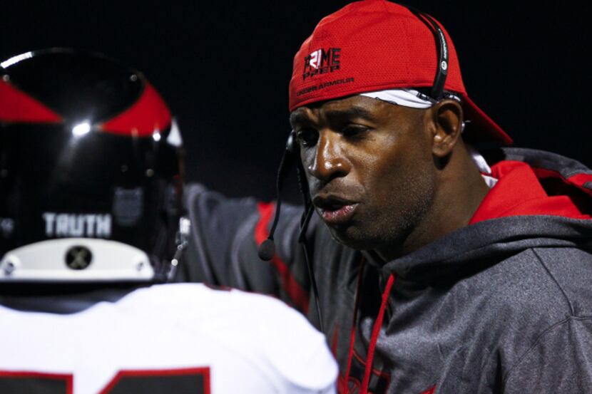 NFL Hall of Famer Deon Sanders coaches Prime Prep from the sidelines during play against...