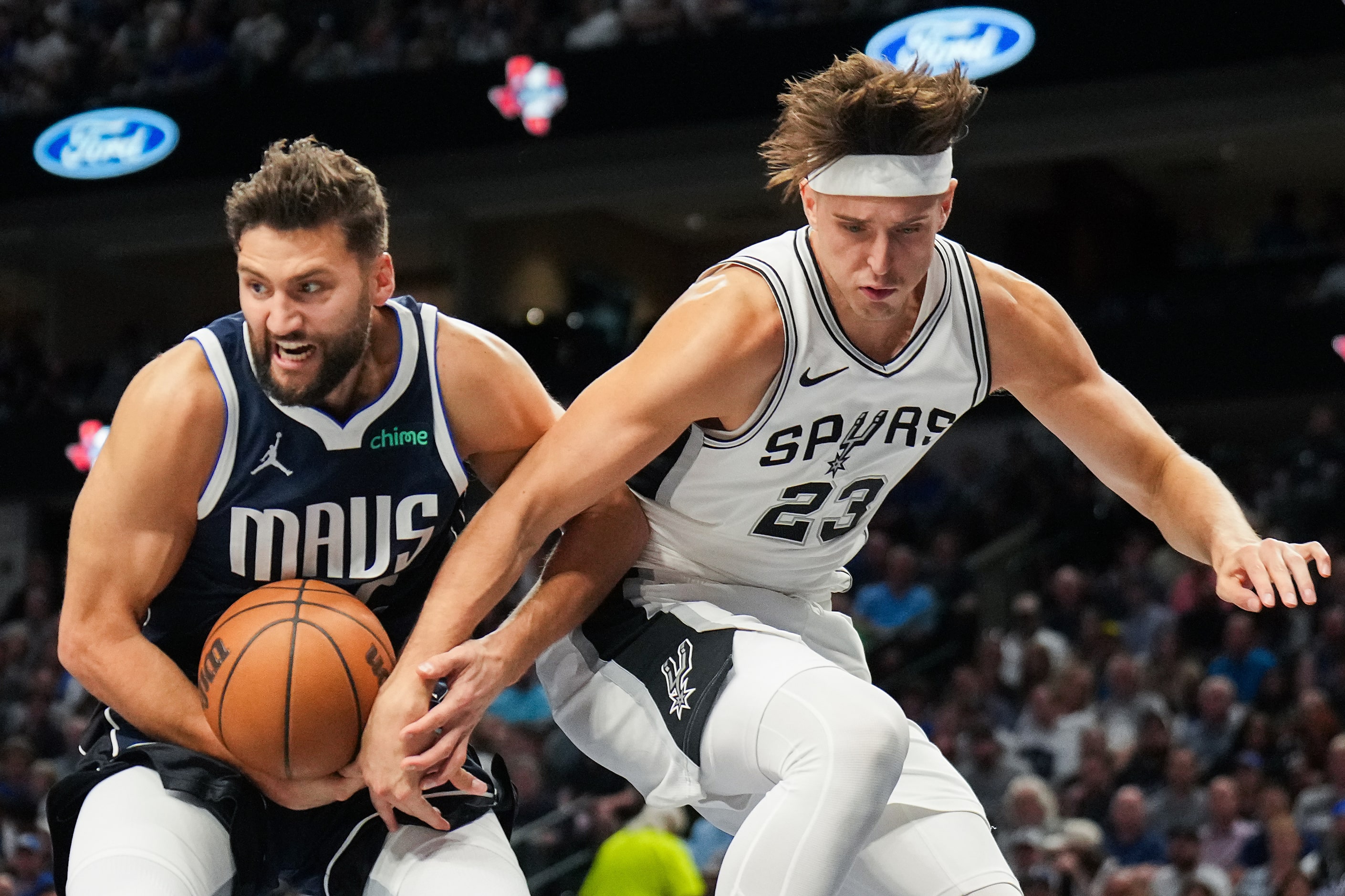 Dallas Mavericks forward Maxi Kleber (42) rips a rebound away from San Antonio Spurs forward...