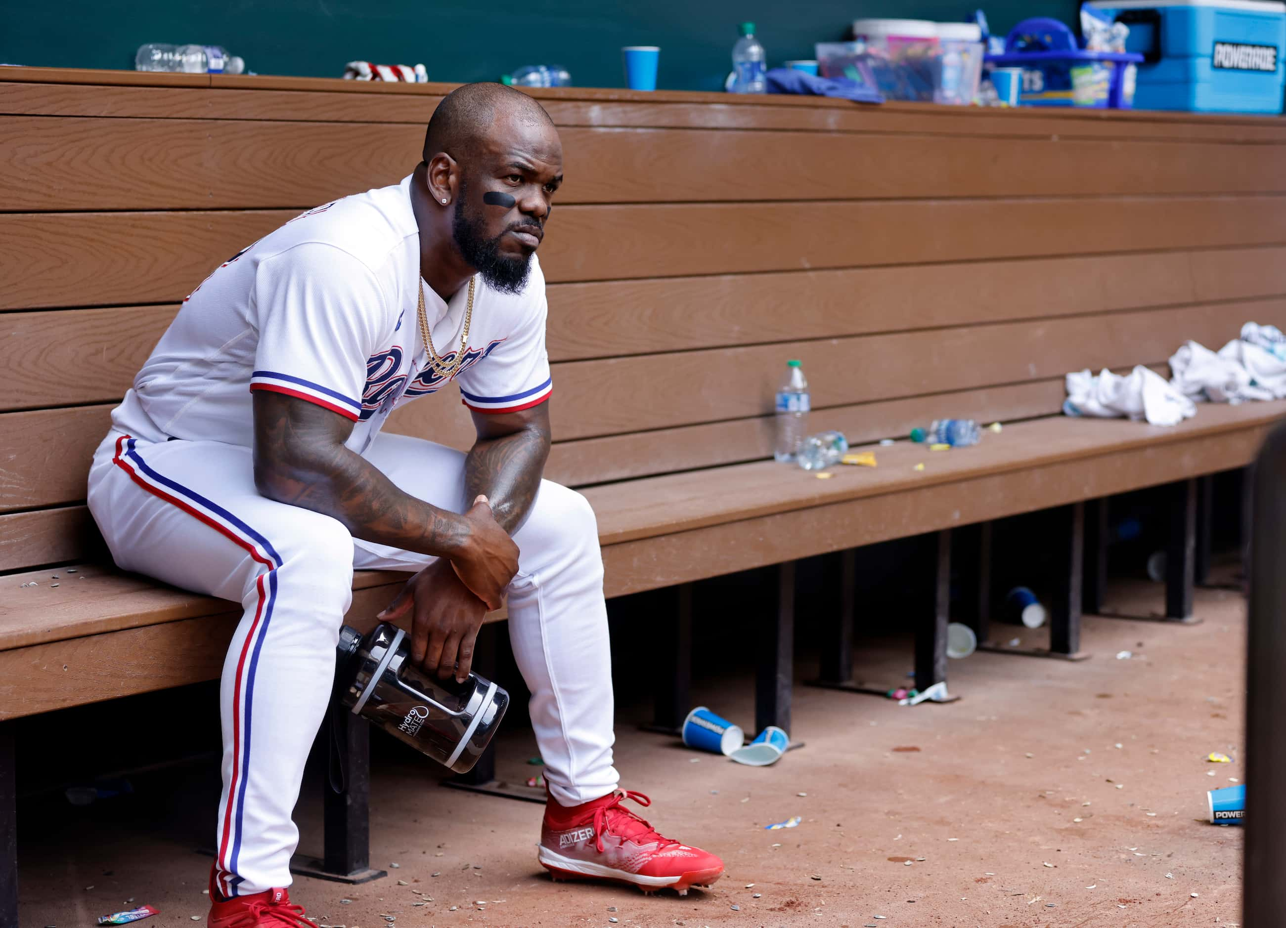 Texas Rangers Adolis Garcia is the last to leave the dugout after their 12-7 loss to the...