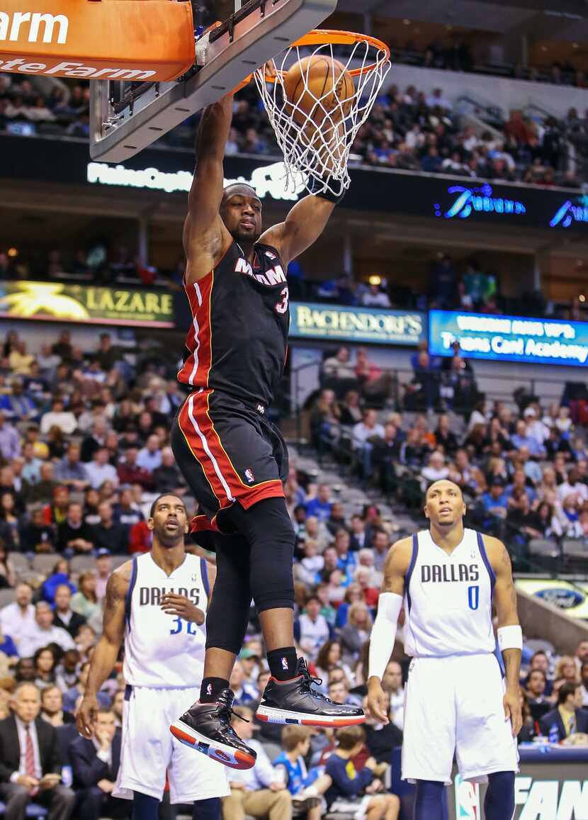 Dec 20, 2012; Dallas, Tx, USA; Miami Heat shooting guard Dwyane Wade (3) dunks during the...