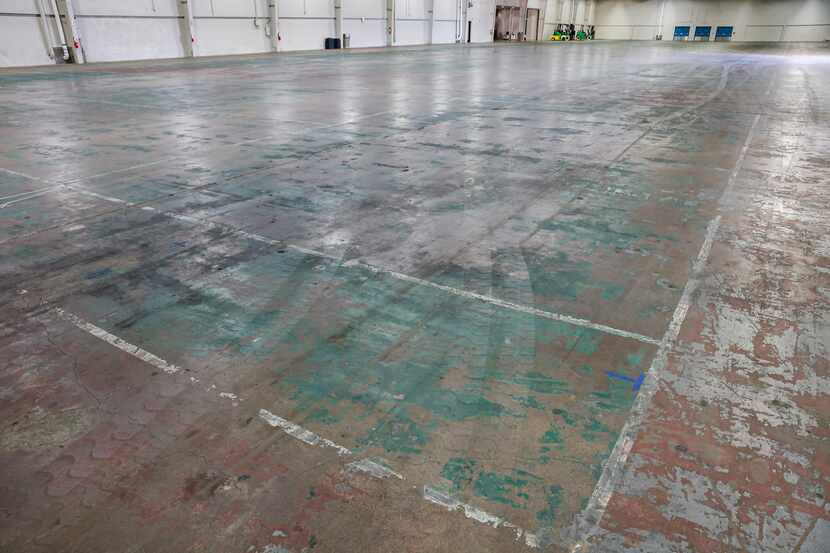 Worn floor that once was used as indoor tennis courts for tournaments in the current...