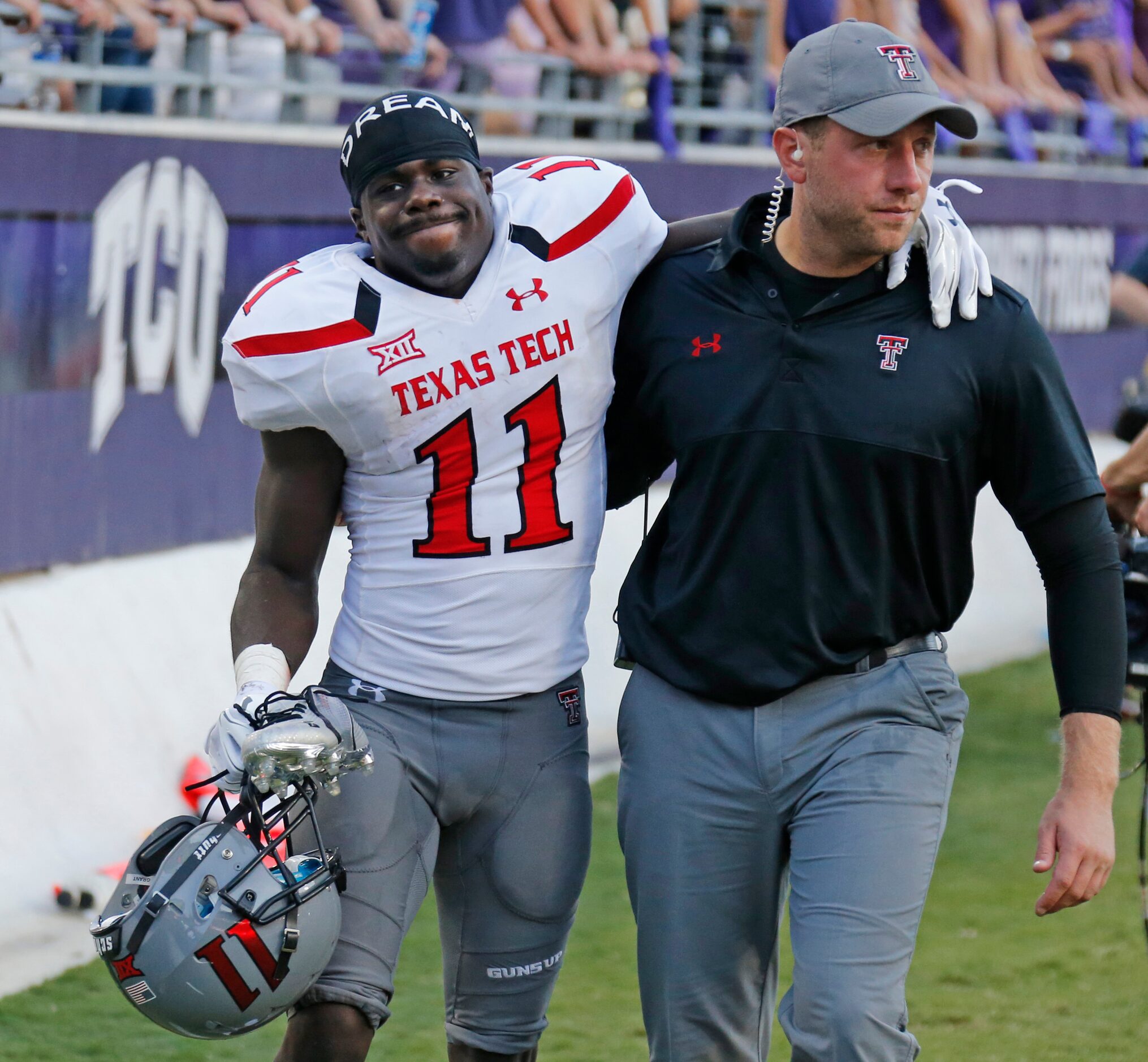 Texas Tech Red Raiders wide receiver Jakeem Grant (11) leaves the field in pain after being...