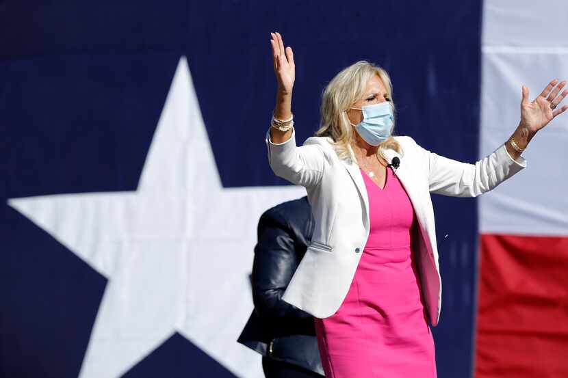 On the first day of early voting, former second lady Jill Biden waves to her supporters as...