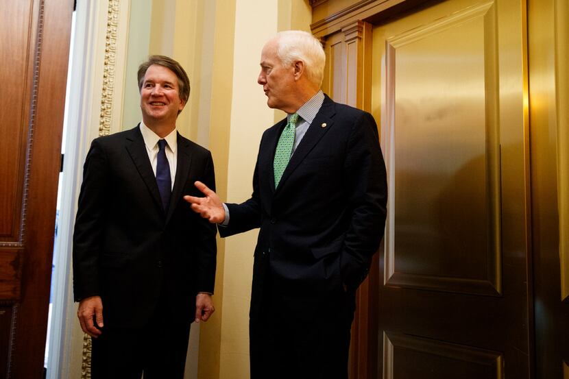 Supreme Court nominee Brett Kavanaugh meets with Sen John Cornyn, R-Texas, right, on Capitol...