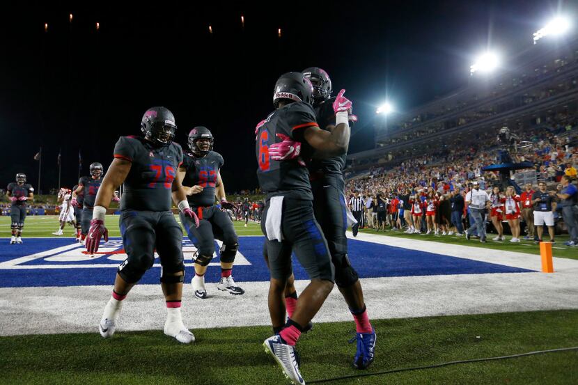 Southern Methodist Mustangs running back Braeden West (6) is congratulated by teammates...