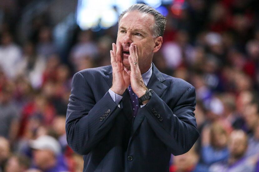 TCU Horned Frogs head coach Jamie Dixon calls out a play during an NCAA basketball game at...