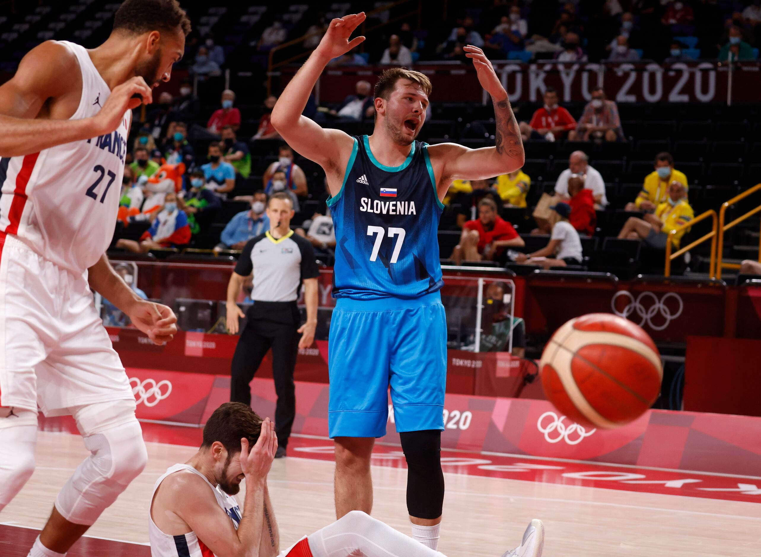 Slovenia’s Luka Doncic (77) reacts after getting called for a foul on France’s Nando de Cold...